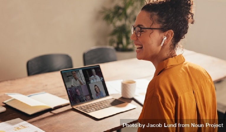 Businesswoman-laughing-during-a-video-call-with-team